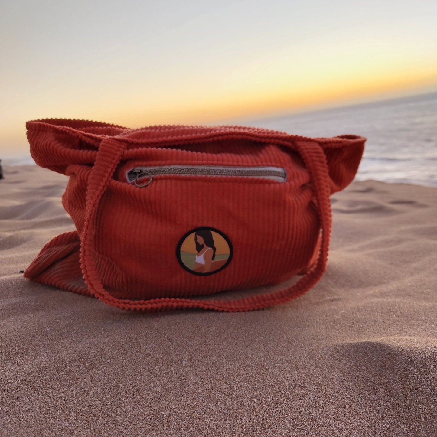Orange tote bag at sunset